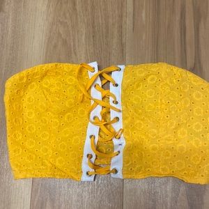 Yellow cropped top. Ties at front